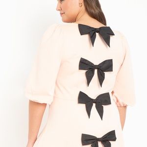 Pink dress with bows down the back